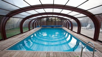 Indoor pool, outdoor pool, pool umbrellas, pool loungers