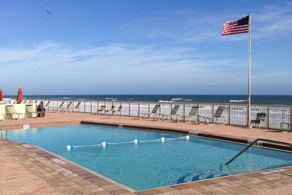Large saltwater pool is heated and adjacent to the beach.