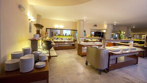 A buffet area with multiple serving stations, a variety of food options, and a clean, modern interior. - Apollon Hotel - Adults Only (Agios Nikolaos)