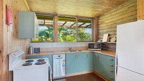 Fridge, microwave, oven, stovetop - 98 Ocean Parade - Rustic Log Cabin (Dalmeny)