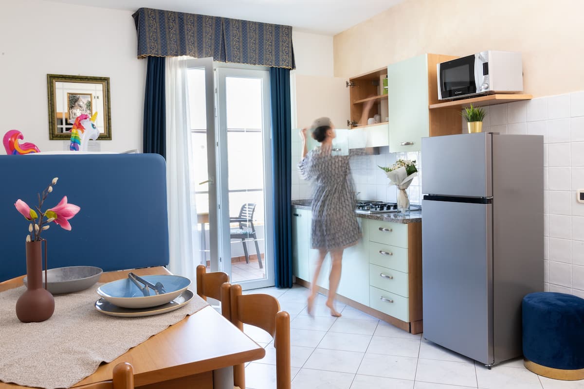 Family Suite, 1 Bedroom, Balcony (Kitchenette) | Living room | 25-inch flat-screen TV with satellite channels, TV, toys