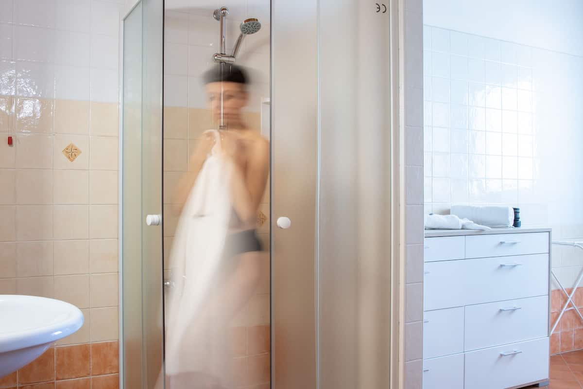 shower, hair dryer, bidet, towels