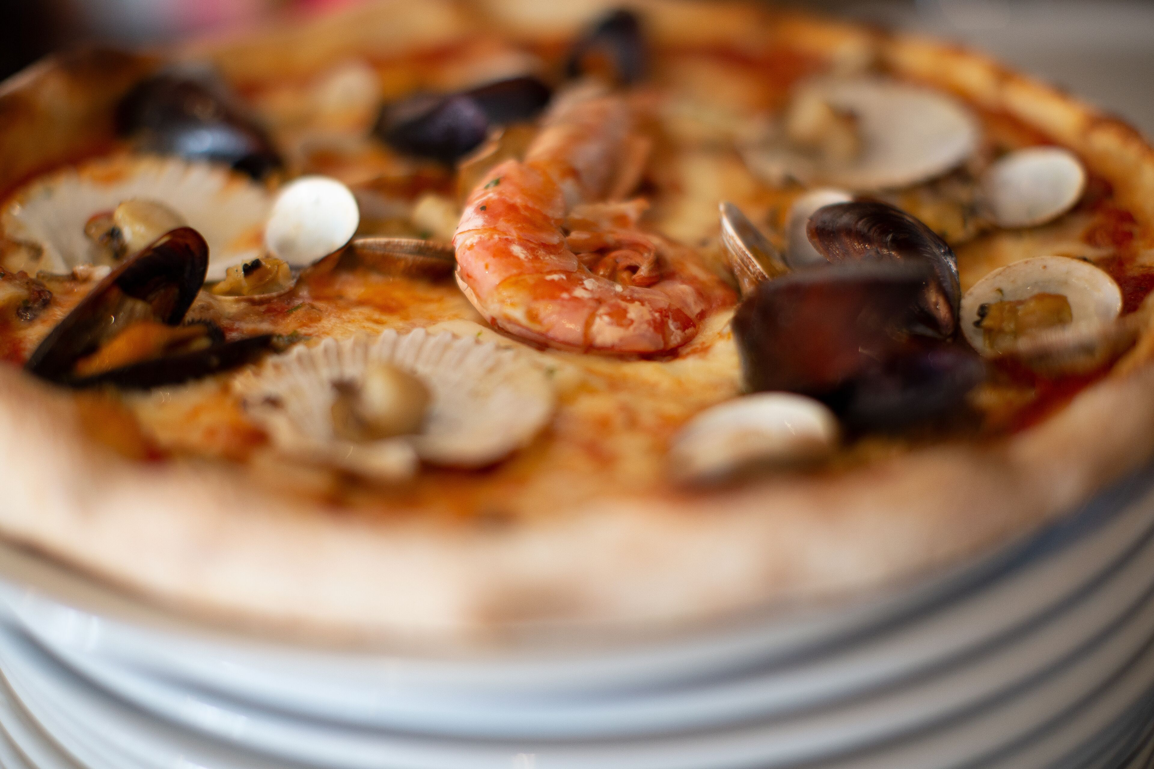 A pizza with seafood toppings.