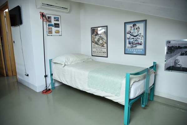 Superior Triple Room | Minibar, in-room safe, desk, blackout drapes