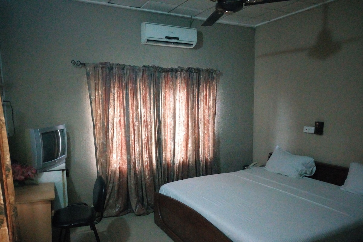 Minibar, desk, bed sheets
