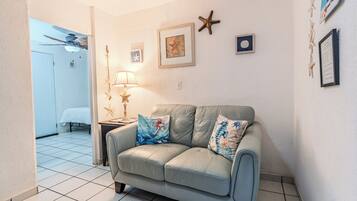 Studio, 1 Queen Bed, Garden View, Garden Area | Living area | 40-inch flat-screen TV with cable channels, TV