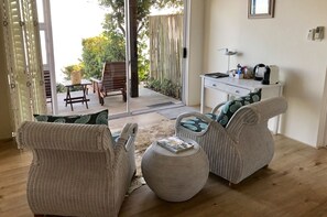 Deluxe Room (Ocean) | Living area | Flat-screen TV - Dune Beach House (Wilderness)