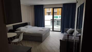 Premium bedding, blackout curtains, soundproofing, iron/ironing board