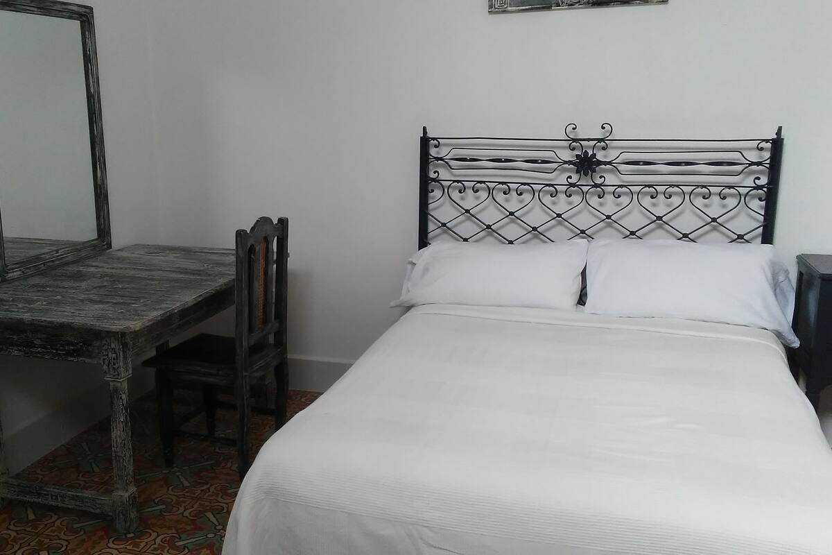 Deluxe Quadruple Room, 2 Queen Beds, Non Smoking | Minibar, in-room safe, individually decorated, individually furnished