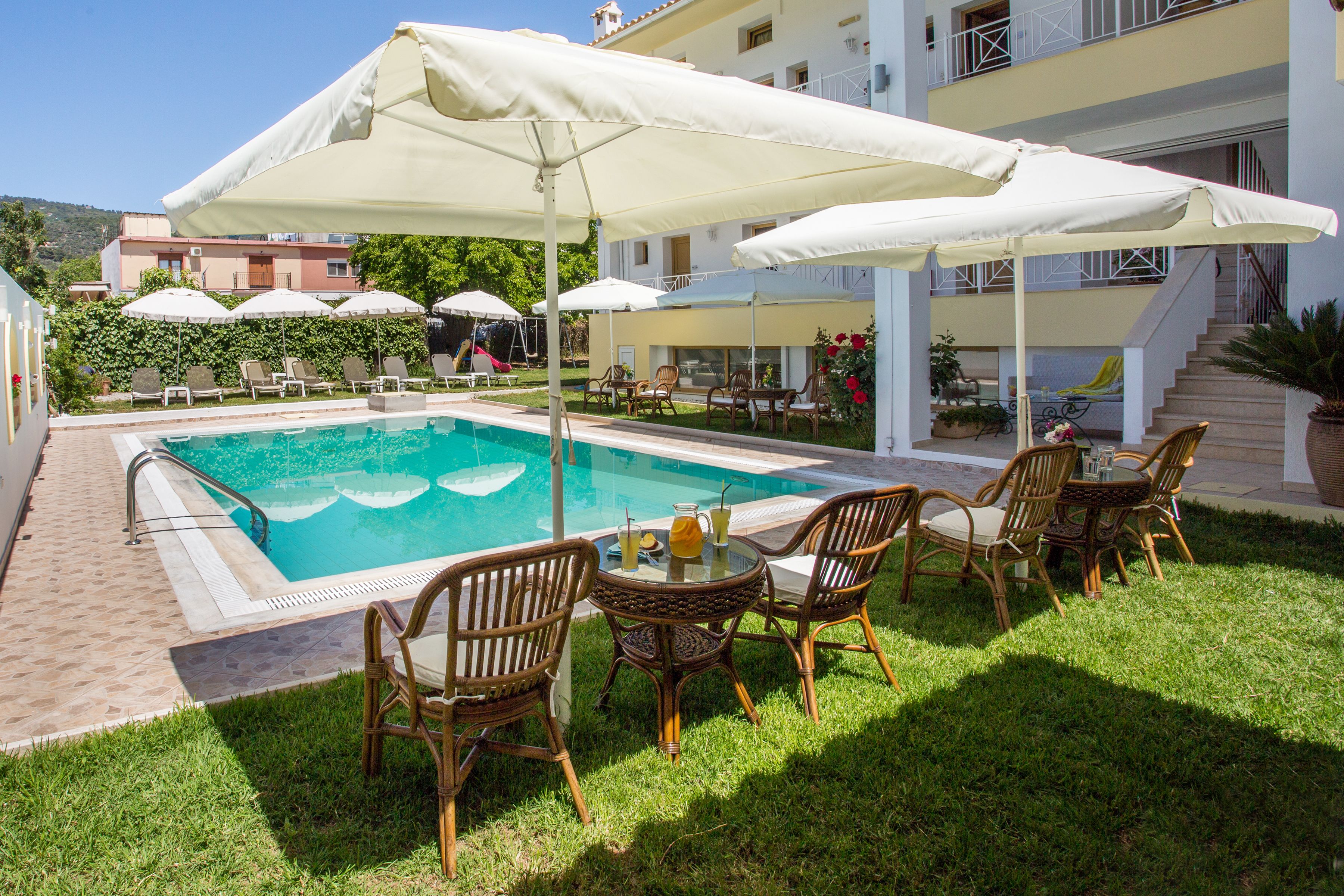 outdoor pool, open 8 am to 8 pm, pool umbrellas, pool loungers