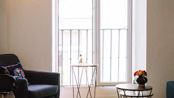 Deluxe Apartment, Balcony | Living area | Flat-screen TV, Netflix