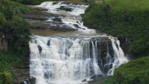 A multi-tiered waterfall surrounded by lush greenery. - Casablanka Rest (Nanuoya)