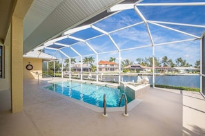 A heated pool - Waterfront 3BR, heated pool, WiFi, and serene Mid-Island views. (Marco Island)