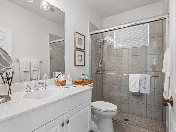 Guest Bath with walk in shower - Waterfront 3BR, heated pool, WiFi, and serene Mid-Island views. (Marco Island)