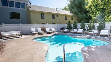 Seasonal outdoor pool, open 9:00 AM to 8:00 PM, pool umbrellas