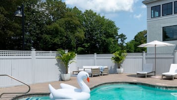 Seasonal outdoor pool, open 9:00 AM to 8:00 PM, pool umbrellas