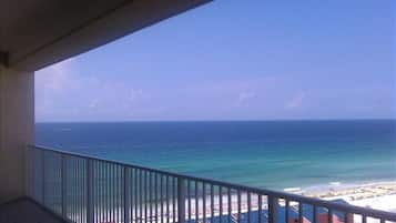 Enjoy breathtaking ocean views from this balcony overlooking the beach.