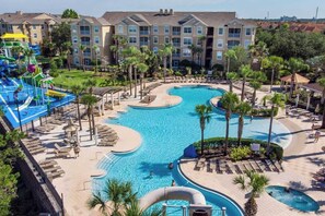 Outdoor pool, sun loungers - Disney Magic Awaits: 5-BDRM, 3-Suites, Pool, Upgraded Perks,  and Tile Flooring! (Kissimmee)