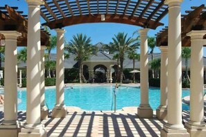 Outdoor pool, sun loungers - Disney Magic Awaits: 5-BDRM, 3-Suites, Pool, Upgraded Perks,  and Tile Flooring! (Kissimmee)