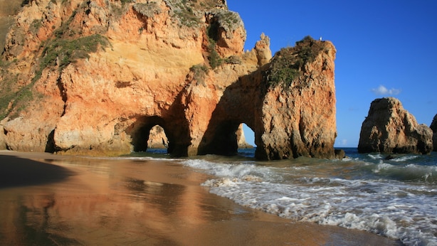 A beach with natural rock formations and waves. - Charming villa, beautiful sea view. Swimming pools. Sand beach. Very calm. (Porches)
