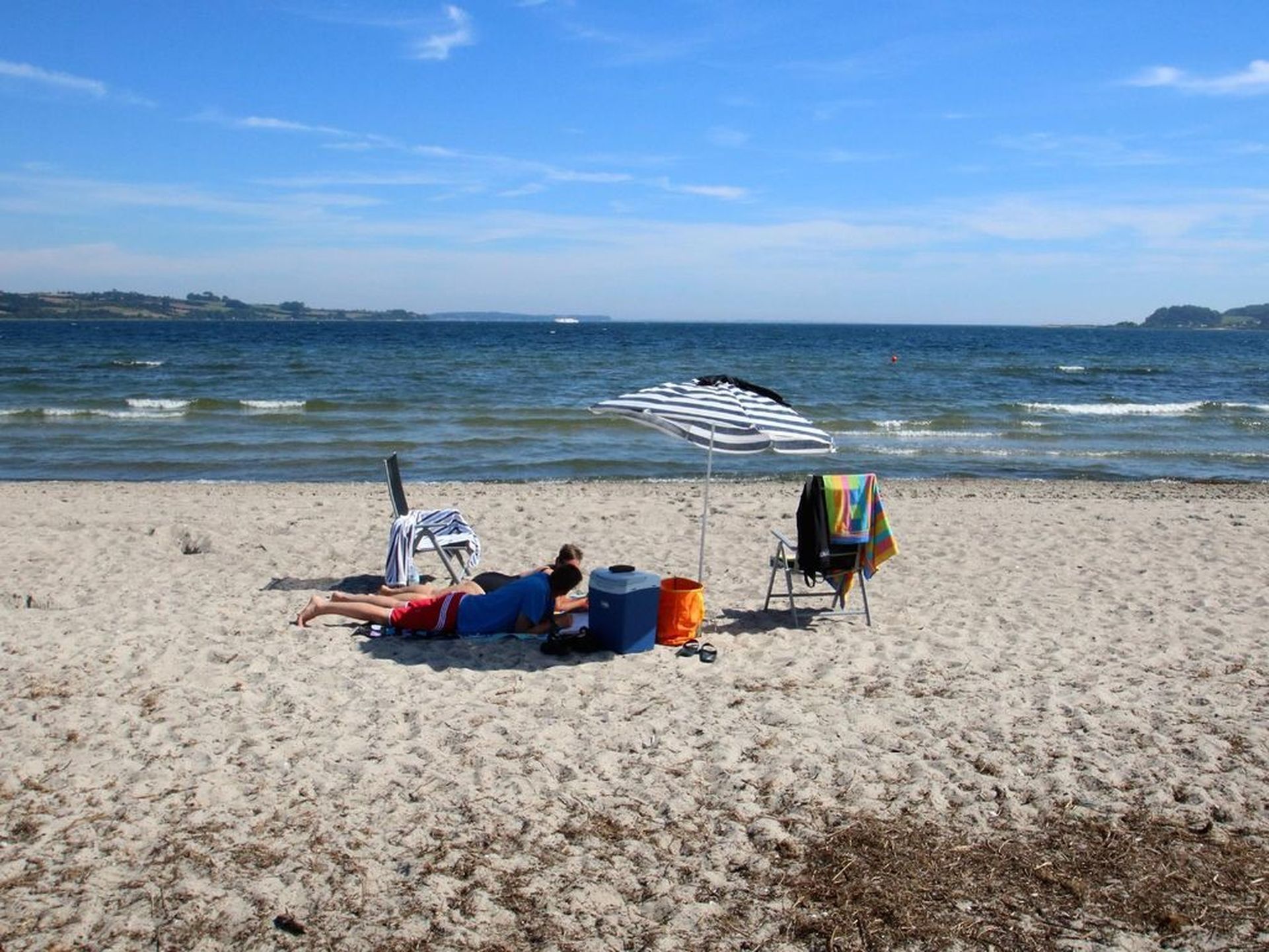 On the beach, sun loungers, beach towels