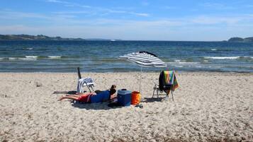 On the beach, sun loungers, beach towels
