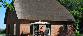 Cottage on park-like grounds with pond