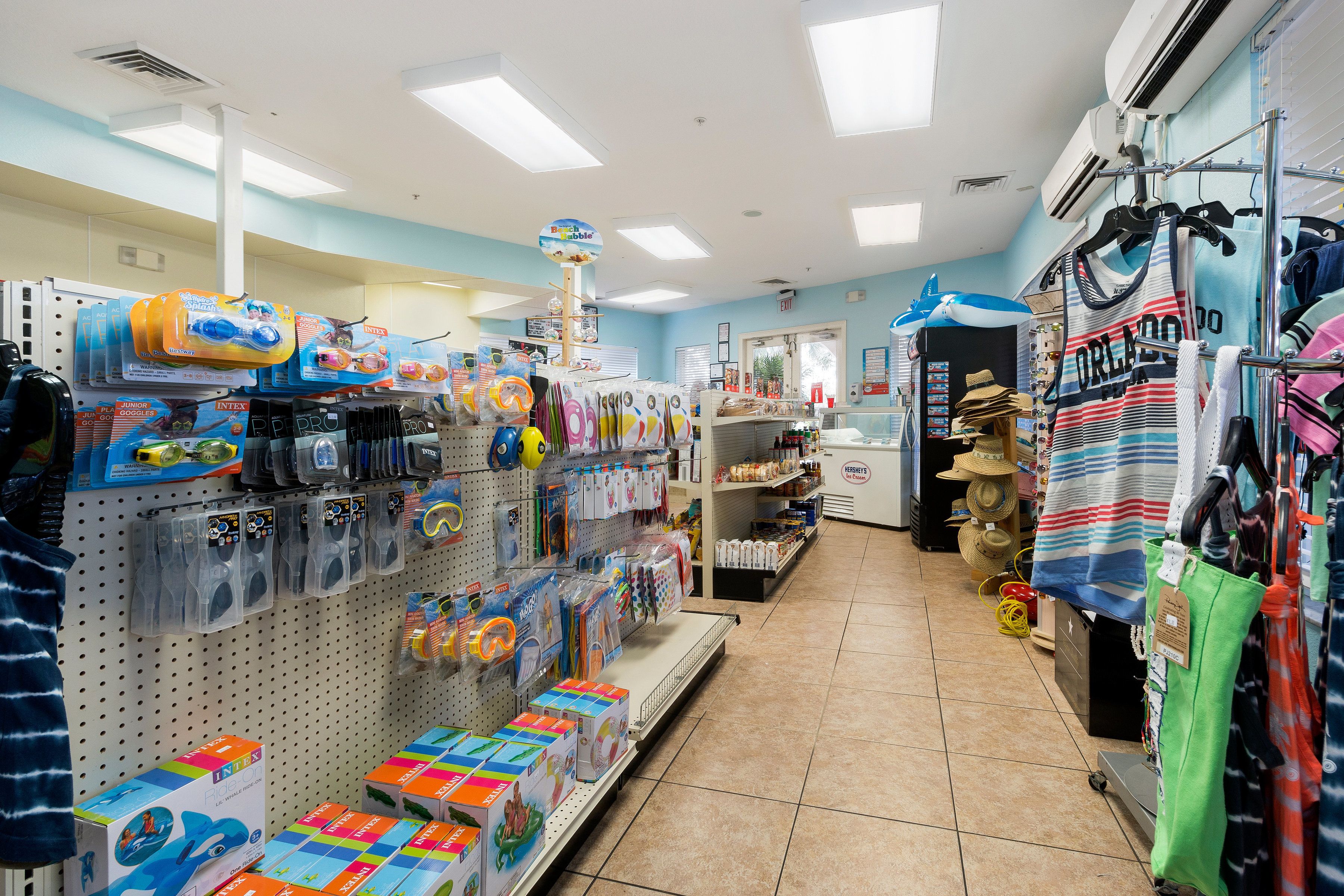 A store with shelves stocked with toys, games, and children's clothing.