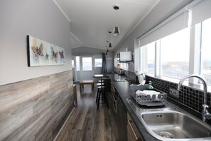 Deluxe Apartment, 1 Bedroom | Private kitchen | Fridge, microwave, stovetop, coffee/tea maker - Skýjaborg Apartments (Höfn)