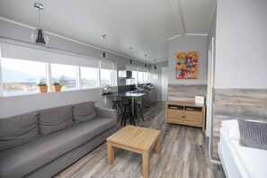 Deluxe Apartment, 1 Bedroom | Living area | Flat-screen TV - Skýjaborg Apartments (Höfn)
