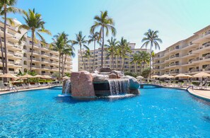 2 outdoor pools, pool umbrellas, pool loungers - Villa del Palmar Beach Resort and Spa - All Inclusive (Puerto Vallarta)