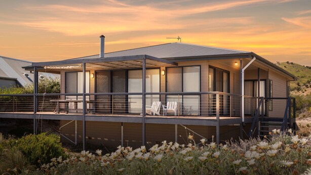 A modern house with a balcony, large windows, and a chimney. - 20 Lady Bay Road Normanville (Normanville)