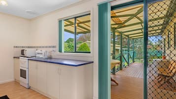 Microwave, oven, stovetop, dining tables