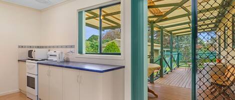 Microwave, oven, stovetop, dining tables