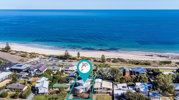 Enjoy ocean views from this coastal home, surrounded by sandy beaches and a forested landscape.