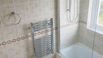 Combined shower/bathtub, hair dryer, towels, toilet paper
