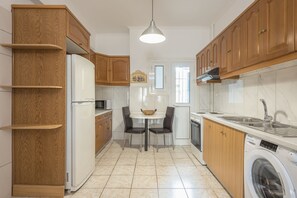 Fridge, microwave, oven, coffee/tea maker - Athenian Apartment is an authentic Greek apartment 1 min from the metro.  (Athina)