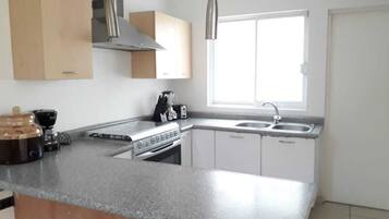 Microwave, coffee/tea maker, cookware/dishes/utensils