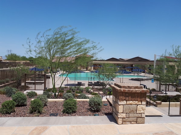 Relax by the resort pool surrounded by lush gardens and comfortable lounge chairs.