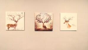 Three framed artworks depicting deer and trees. - Casa Le Rock (Langkawi)