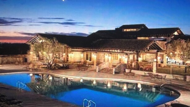 A swimming pool with a patio area, a covered outdoor seating area, and a building with a sloped roof. - Furnished, 31 day min. gated cul de sac
Las Sendas amenities incl., 3 car garage (Mesa)
