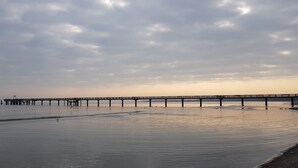 A pier extending into calm waters with a cloudy sky above. - Wonderful apartment! WLAN Only 400m to the sea and the center (Osteseebad Boltenhagen)