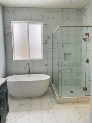 Bathtub, hair dryer, towels, soap