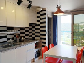 Family Room | Private kitchen | Full-size fridge, microwave, stovetop, electric kettle - Black Beach Pension (Yeosu)
