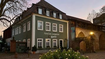 Experience the charm of a traditional European hotel, set amidst a historic courtyard with a classic architectural design and a restaurant on the ground floor.