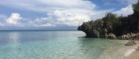 On the beach, white sand, free beach cabanas, sun-loungers