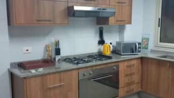 Premium Apartment, 3 Bedrooms | Private kitchen | Full-size fridge, microwave, oven, stovetop