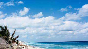 On the beach, sun-loungers, beach towels