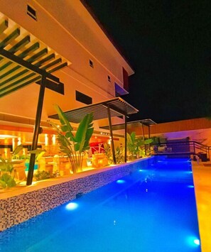 Outdoor pool, open 7:00 AM to 11:00 PM, pool umbrellas