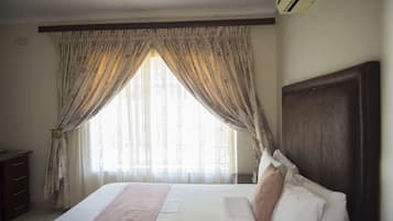 Premium bedding, down duvets, desk, laptop workspace